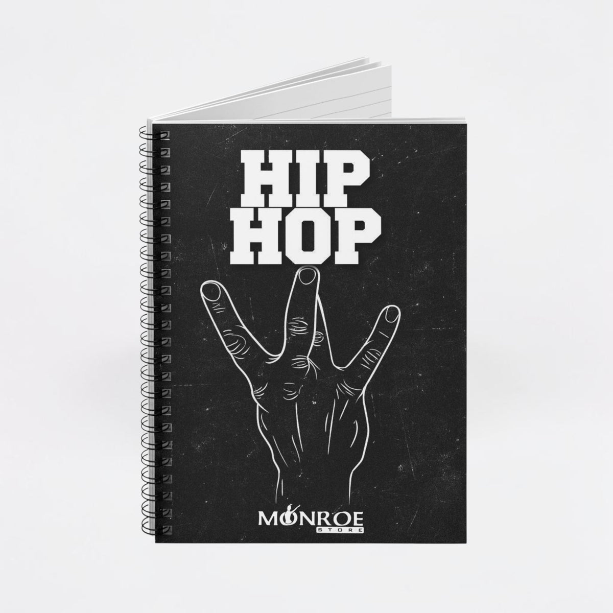 MONROE STORE black spiral notebook featuring a white hand gesture graphic and Hip Hop text on the cover.