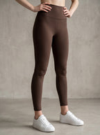 MONROE STORE dark brown high-waisted skinny yoga leggings with a V-shaped seam on the back.