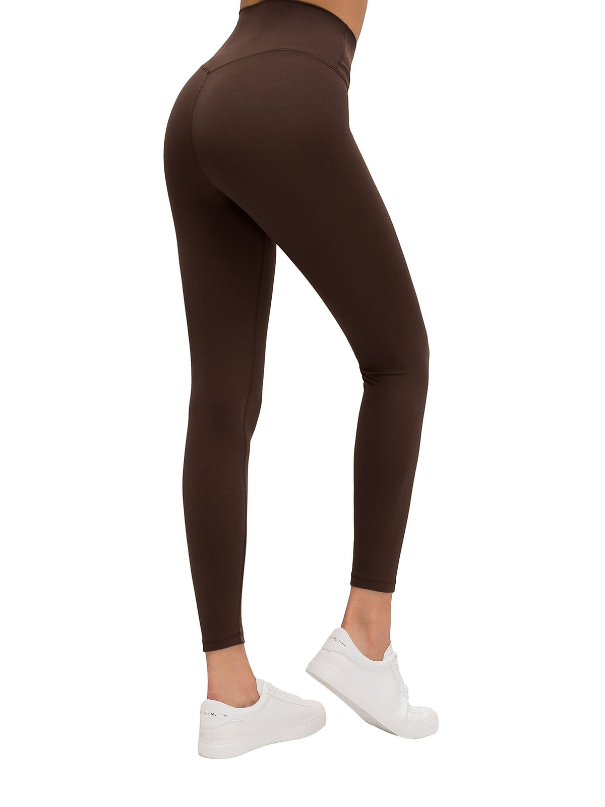 MONROE STORE high-waisted brown yoga leggings with a V-shaped seam on the back, made of a stretchy material.