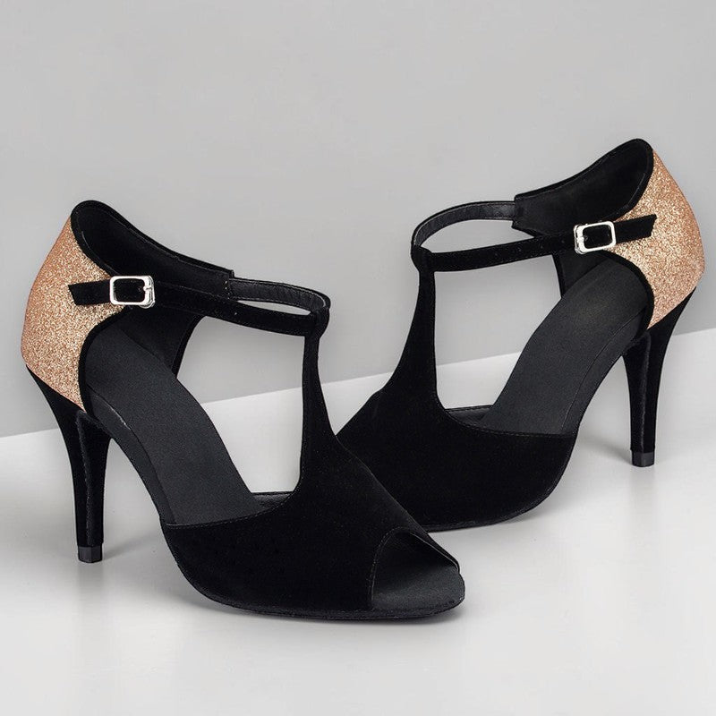 Zapatos de baile latino MONROE STORE de ante negro con tacón de aguja, puntera abierta y detalle de purpurina dorada.